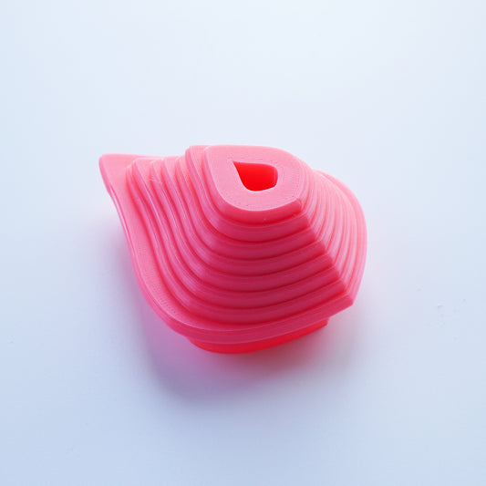 Pink pear shaped clay cutters nested from largest size available to smallest size available.