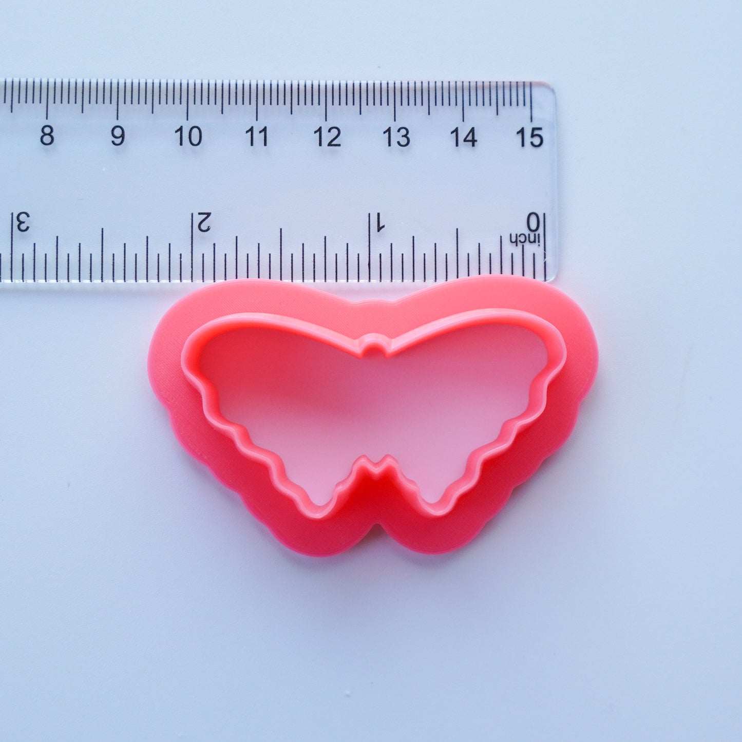 Pink Butterfly Clay Cutter is shown below a ruler that measures the cutter as 2.00 inch.