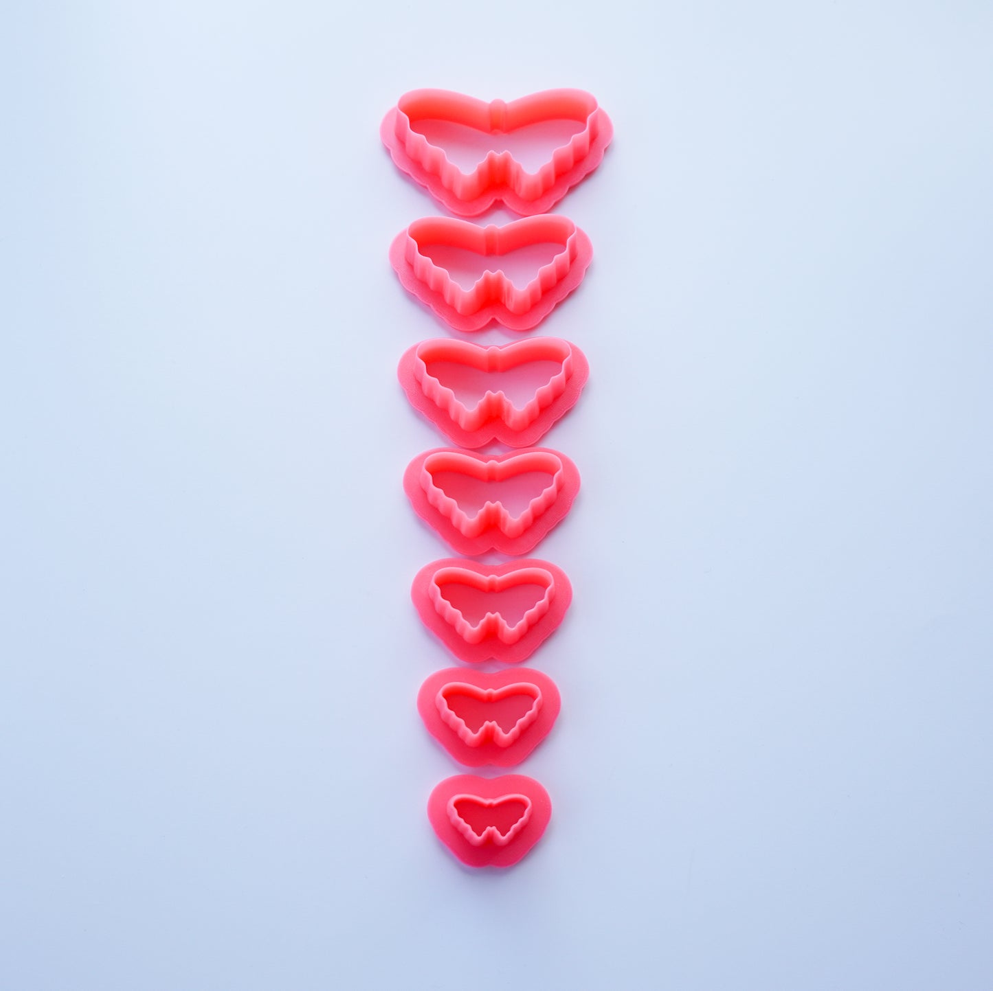 Pink Butterfly clay cutters shown in all available sizes.