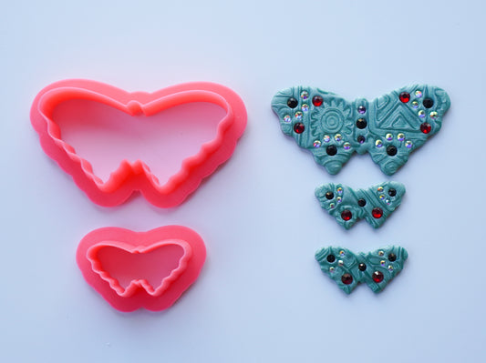 Pink Butterfly cutters is shown next to a sample of polymer clay art made using those cutters