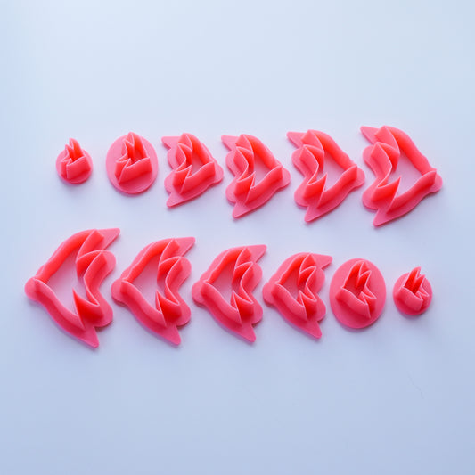 Set of pink tropical fish clay cutters shown in all available sizes as well as mirrored options