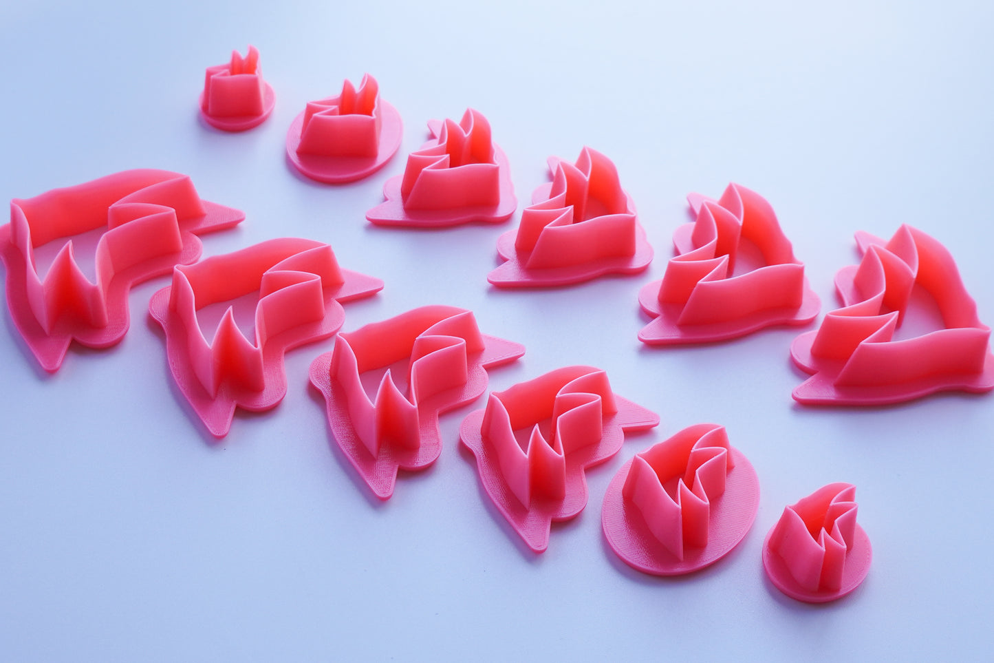 Mirrored Pink Tropical Fish Clay Cutters shown in all available sizes and options.